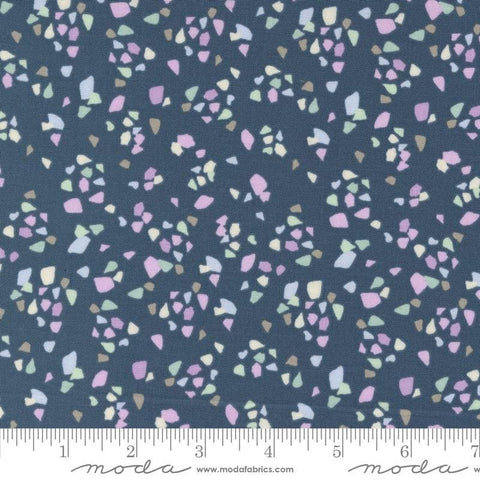 Image of the Seaglass Summer Pebble Indigo Sea quilting cotton fabric by Moda Fabrics. Features shapes on a navy blue background. Cute Little Fabric Shop