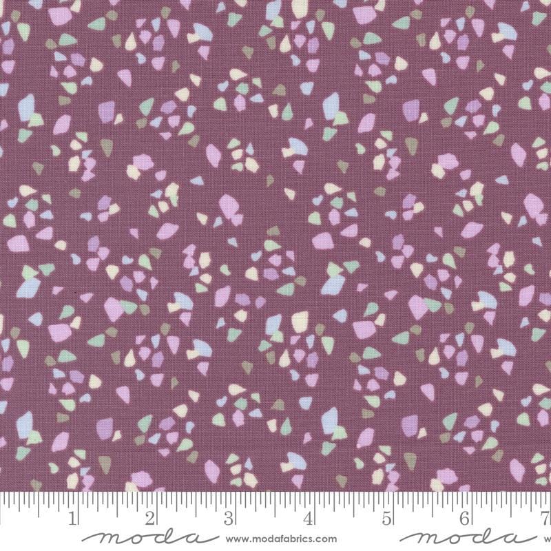 Image of the Seaglass Summer Pebble Beach Plum quilting cotton fabric by Moda Fabrics. Features shapes on a purple background. Cute Little Fabric Shop