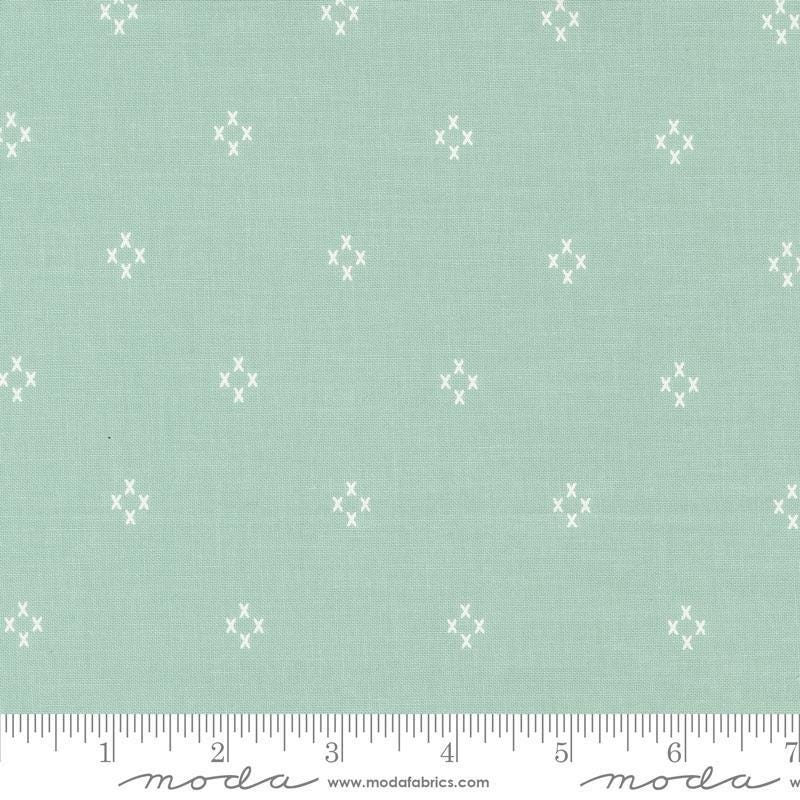 Image of the Seaglass Summer Cross Ocean AIr quilting cotton fabric by Moda Fabrics. Features crosses on a mint background. Cute Little Fabric Shop