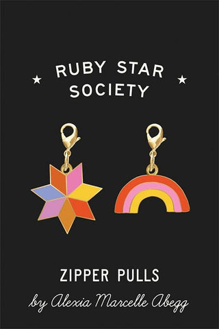 Image of the Alexia Zipper Pulls by Ruby Star Society for Moda Fabrics. Features a quilt star and rainbow set of zipper pulls. 
Cute Little Fabric Shop