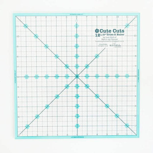 Image of the Lori Holt Cute Cuts™ Trim-it™ Ruler 12 1/2" x 12 1/2" by Riley Blake Designs. Features a large clear ruler. 
Cute Little Fabric Shop