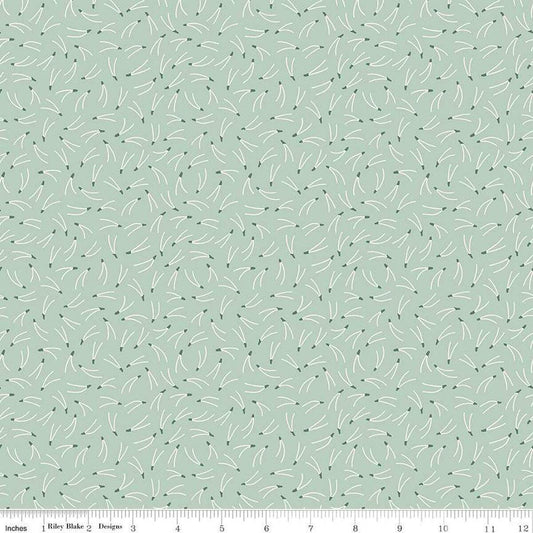 Image of the Forest Village Needles Sage quilting cotton fabric by Little Forest Atelier for Riley Blake Designs. Features a pine needles on a green background. Cute Little Fabric Shop