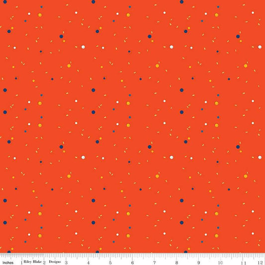 Image of the Pop 'n Play Confetti Sunset quilting cotton fabric by Fisher-Price for Riley Blake Designs. Features spots on an orange background. Cute Little Fabric Shop