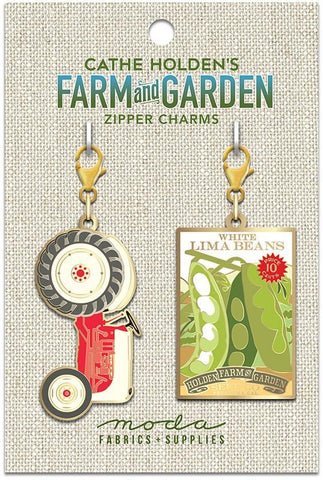 Image of the Tractor Zipper Pulls 2ct by Cathe Holden for Moda Fabrics. Features two farm themed charms.
Cute Little Fabric Shop