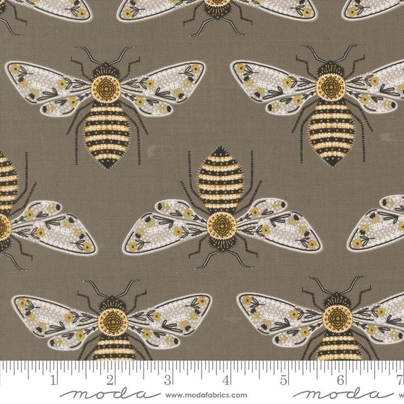 Image of the Bee Garden Metallic Bumblebee Slate quilting cotton fabric by Gingiber for Riley Blake Designs. Features bees on a brown background. Cute Little Fabric Shop