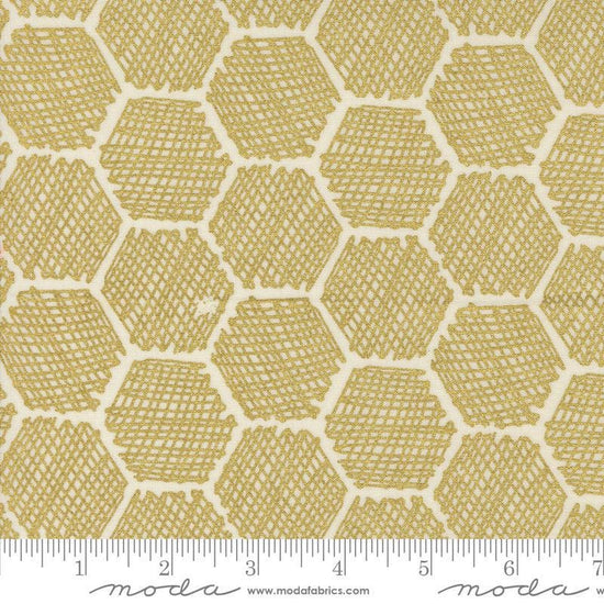 Image of the Bee Garden Metallic Honeycomb Porcelain quilting cotton fabric by Gingiber for Riley Blake Designs. Features honeycomb on a yellow background. Cute Little Fabric Shop