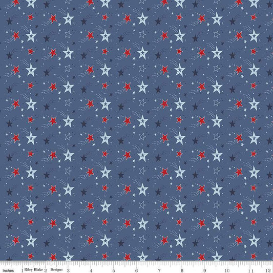 Image of the Stars and Stripes Forever Shooting Stars Blue quilting cotton fabric by Lori Whitlock for Riley Blake Designs. Features stars on a blue background. Cute Little Fabric Shop