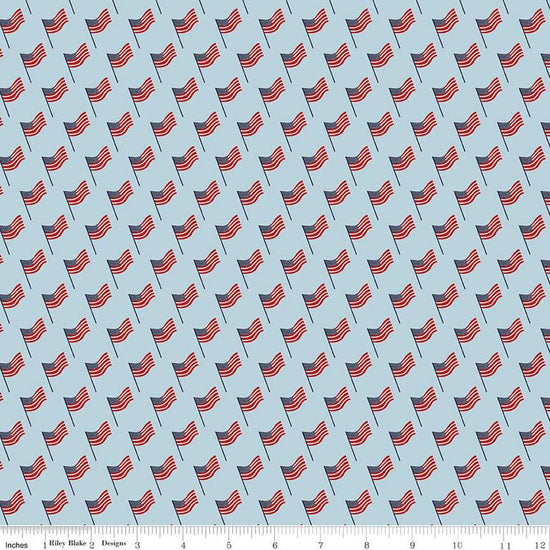Image of the Stars and Stripes Forever Flags Sky quilting cotton fabric by Lori Whitlock for Riley Blake Designs. Features flags on a blue background. Cute Little Fabric Shop