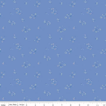 Image of the Yacht Club Bubbles Sky quilting cotton fabric by Amanda Niederhauser for Riley Blake Designs. Features circles on a blue background. Cute Little Fabric Shop