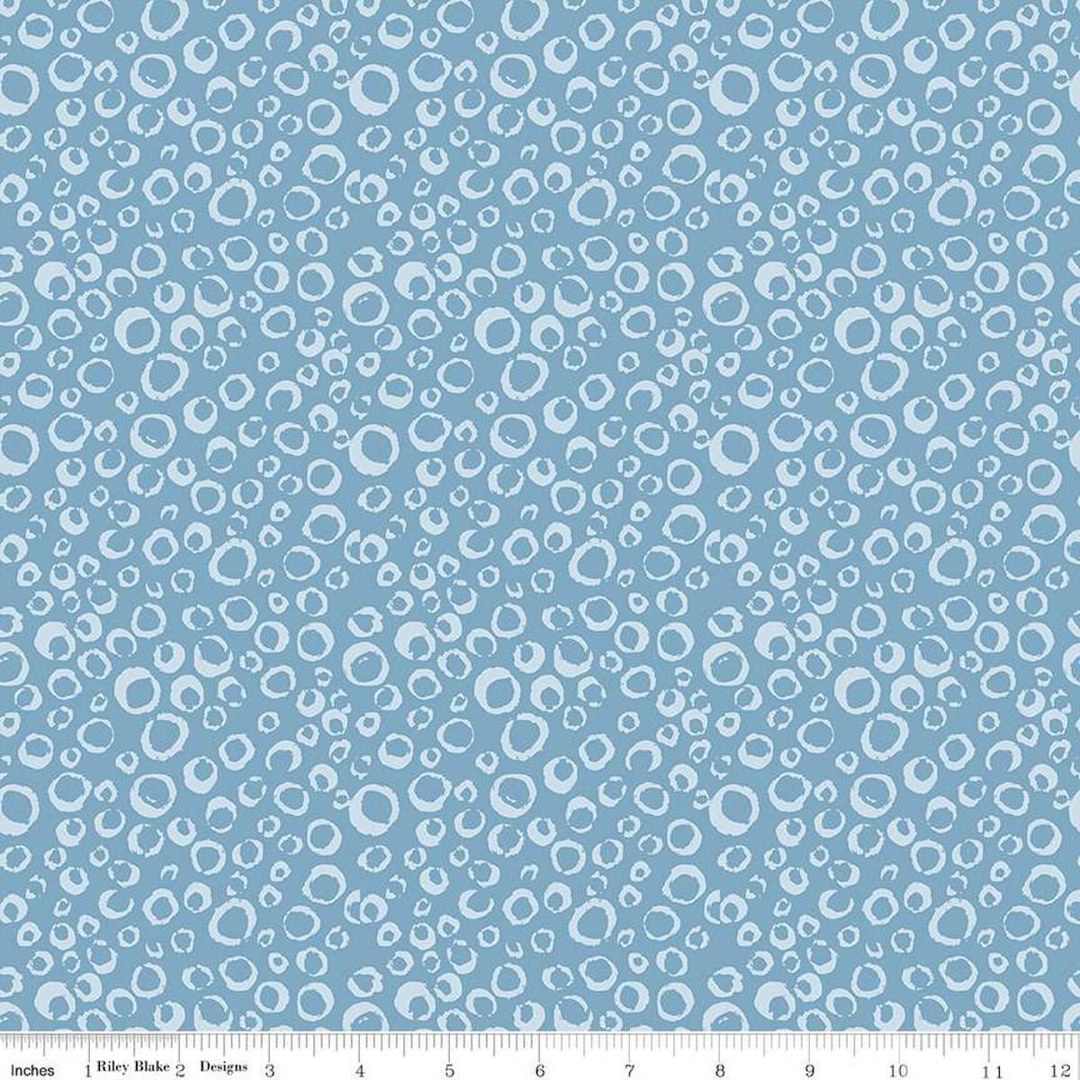 Image of the Ocean Oasis Bubbles Stone quilting cotton fabric by Diane Labombarbe for Riley Blake Designs. Features bubbles on a blue background. Cute Little Fabric Shop