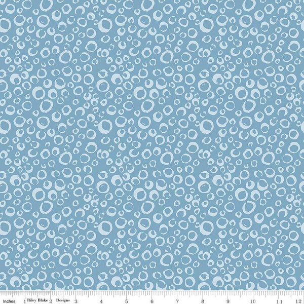Image of the Ocean Oasis Bubbles Stone quilting cotton fabric by Diane Labombarbe for Riley Blake Designs. Features bubbles on a blue background. Cute Little Fabric Shop