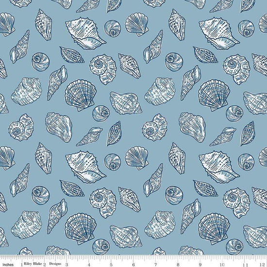 Image of the Ocean Oasis Seashells Stone quilting cotton fabric by Diane Labombarbe for Riley Blake Designs. Features shells on a blue background. Cute Little Fabric Shop