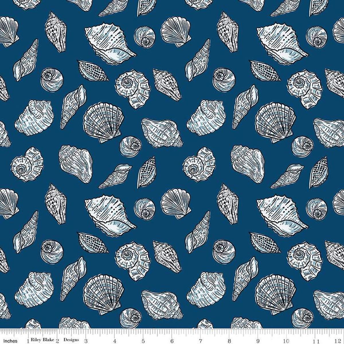 Image of the Ocean Oasis Seashells Night quilting cotton fabric by Diane Labombarbe for Riley Blake Designs. Features shells on a blue background. Cute Little Fabric Shop