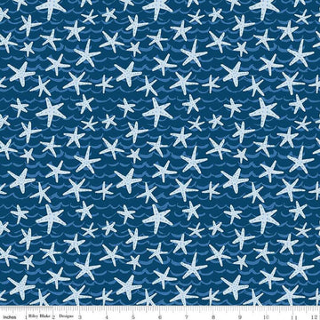 Image of the Ocean Oasis Starfish Night quilting cotton fabric by Diane Labombarbe for Riley Blake Designs. Features starfish on a blue background. Cute Little Fabric Shop