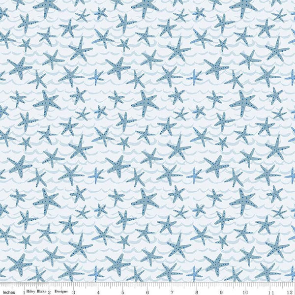 Image of the Ocean Oasis Starfish Mist quilting cotton fabric by Diane Labombarbe for Riley Blake Designs. Features starfish on a blue background. Cute Little Fabric Shop
