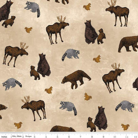 Image of the Pine Grove Animal Toss Putty quilting cotton fabric by Riley Blake Designs. Features animals on a brown background. Cute Little Fabric Shop