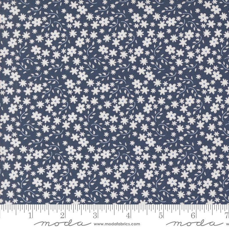 Image of the Raspberry Summer Blossoms Blueberry quilting cotton fabric by Sherri & Chelsi for Moda Fabrics. Features flowers on a blue background. Cute Little Fabric Shop