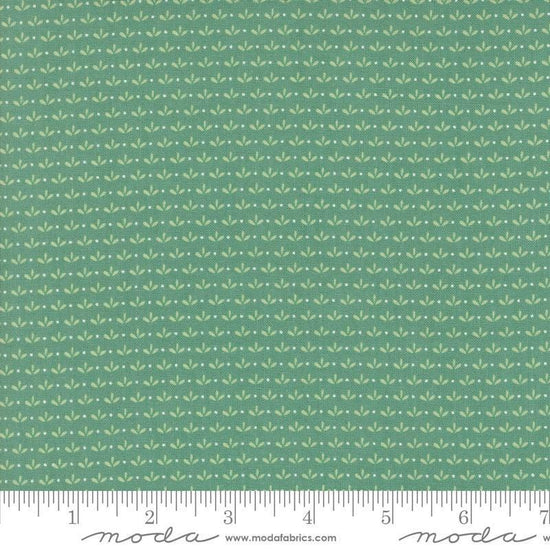Image of the Raspberry Summer Sprout Teal quilting cotton fabric by Sherri & Chelsi for Moda Fabrics. Features leaves on a green background. Cute Little Fabric Shop