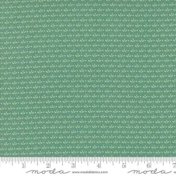Image of the Raspberry Summer Sprout Teal quilting cotton fabric by Sherri & Chelsi for Moda Fabrics. Features leaves on a green background. Cute Little Fabric Shop