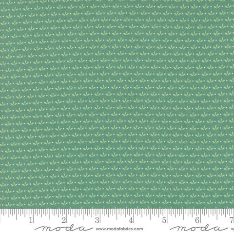 Image of the Raspberry Summer Sprout Teal quilting cotton fabric by Sherri & Chelsi for Moda Fabrics. Features leaves on a green background. Cute Little Fabric Shop