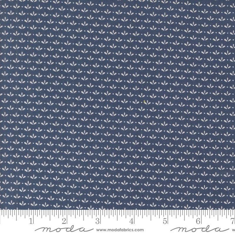 Image of the Raspberry Summer Sprout Blueberry quilting cotton fabric by Sherri & Chelsi for Moda Fabrics. Features leaves on a blue background. Cute Little Fabric Shop