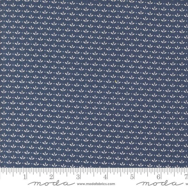 Image of the Raspberry Summer Sprout Blueberry quilting cotton fabric by Sherri & Chelsi for Moda Fabrics. Features leaves on a blue background. Cute Little Fabric Shop