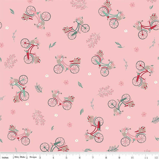 Image of the Berry Market Bicycles Frosting quilting cotton fabric by Beverly McCullough for Riley Blake Designs. Features bikes on a pink background. Cute Little Fabric Shop