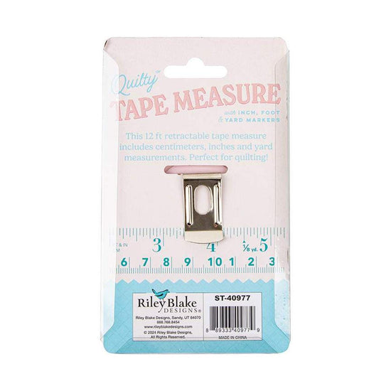 Image of the Quilty™ Measure Tape by Riley Blake Designs. Features a pink tape measure. 
Cute Little Fabric Shop