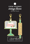 Image of the Baking Sew Cute Vintage Charm Zipper Pulls. Features two small enamel charms. 
Cute Little Fabric Shop