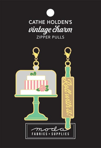 Image of the Baking Sew Cute Vintage Charm Zipper Pulls. Features two small enamel charms. 
Cute Little Fabric Shop