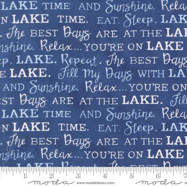 Image of the On Lake Time Words Deep Water quilting cotton fabric by Deb Strain for Moda Fabrics. Features words on a blue background. Cute Little Fabric Shop
