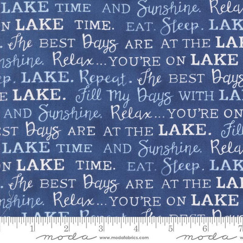 Image of the On Lake Time Words Deep Water quilting cotton fabric by Deb Strain for Moda Fabrics. Features words on a blue background. Cute Little Fabric Shop