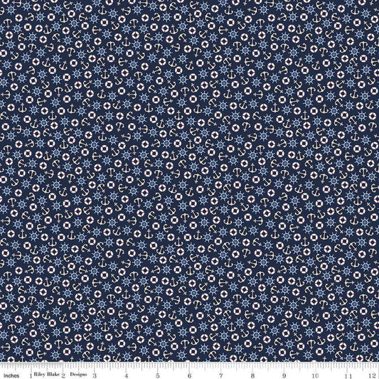 Image of the Yacht Club Toss Navy quilting cotton fabric by Amanda Niederhauser for Riley Blake Designs. Features boat symbols on a blue background. Cute Little Fabric Shop
