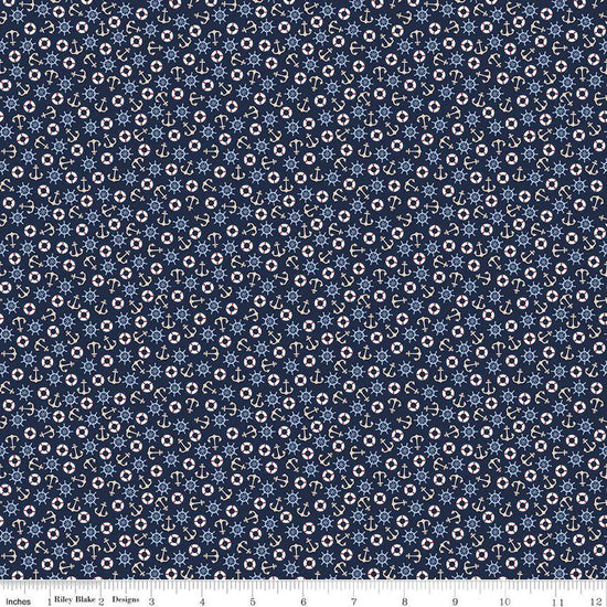 Image of the Yacht Club Toss Navy quilting cotton fabric by Amanda Niederhauser for Riley Blake Designs. Features boat symbols on a blue background. Cute Little Fabric Shop