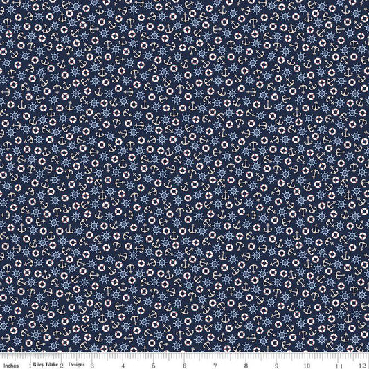 Image of the Yacht Club Toss Navy quilting cotton fabric by Amanda Niederhauser for Riley Blake Designs. Features boat symbols on a blue background. Cute Little Fabric Shop