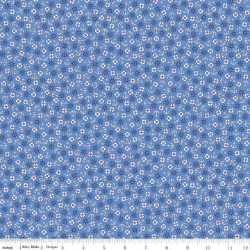 Image of the Yacht Club Toss Blue quilting cotton fabric by Amanda Niederhauser for Riley Blake Designs. Features boat symbols on a blue background. Cute Little Fabric Shop