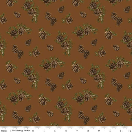 Image of the Pine Grove Pinecones Brown quilting cotton fabric by Riley Blake Designs. Features trees on a brown background. Cute Little Fabric Shop