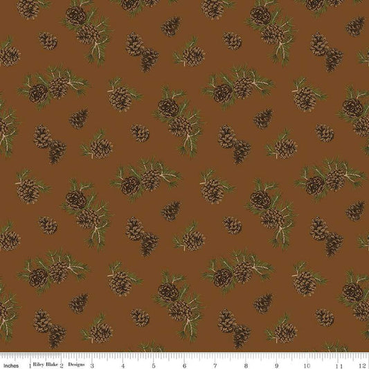 Image of the Pine Grove Pinecones Brown quilting cotton fabric by Riley Blake Designs. Features trees on a brown background. Cute Little Fabric Shop