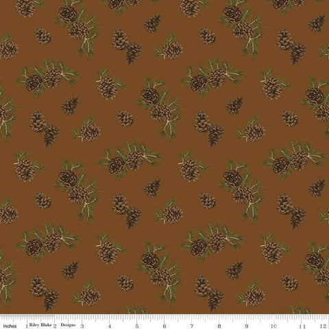 Image of the Pine Grove Pinecones Brown quilting cotton fabric by Riley Blake Designs. Features trees on a brown background. Cute Little Fabric Shop