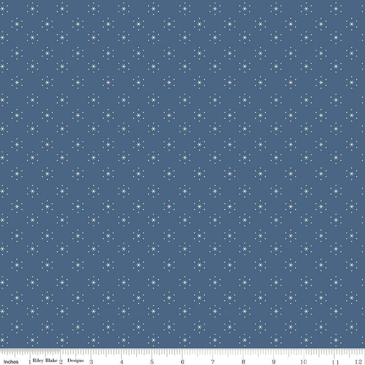 Image of the Americana Sparkle Denim quilting cotton fabric by Lori Holt for Riley Blake Designs. Features stars on a blue background. Cute Little Fabric Shop