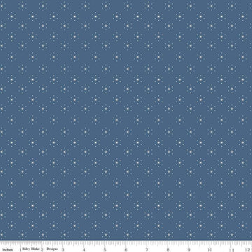 Image of the Americana Sparkle Denim quilting cotton fabric by Lori Holt for Riley Blake Designs. Features stars on a blue background. Cute Little Fabric Shop