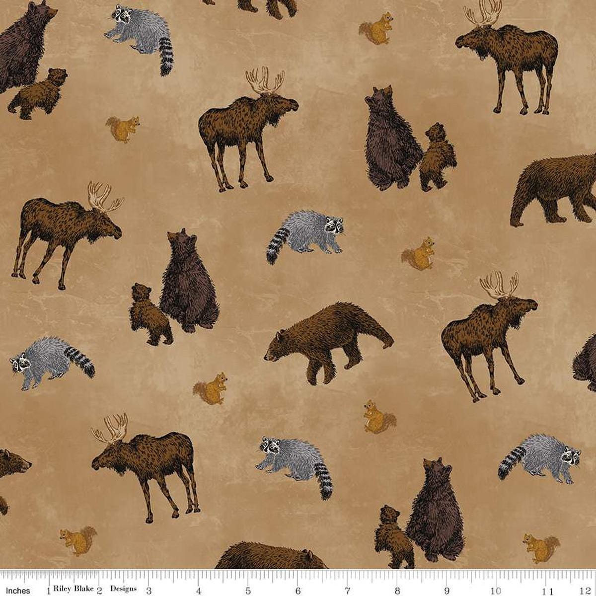 Image of the Pine Grove Animal Toss Tan quilting cotton fabric by Riley Blake Designs. Features animals on a brown background. Cute Little Fabric Shop