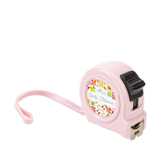 Image of the Quilty™ Measure Tape by Riley Blake Designs. Features a pink tape measure. 
Cute Little Fabric Shop