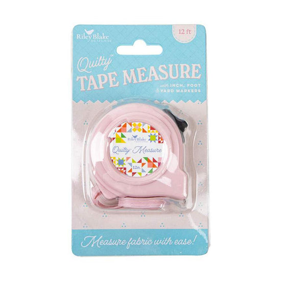 Image of the Quilty™ Measure Tape by Riley Blake Designs. Features a pink tape measure. 
Cute Little Fabric Shop
