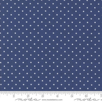 Image of the Star Spangled Twinkle Twilight quilting cotton fabric by Moda Fabrics. Features stars on a blue background. Cute Little Fabric Shop