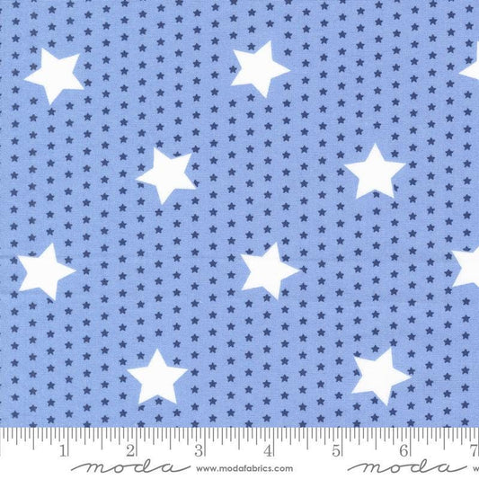 Image of the Star Spangled Stars Shining Sea quilting cotton fabric by Moda Fabrics. Features stars on a blue background. Cute Little Fabric Shop
