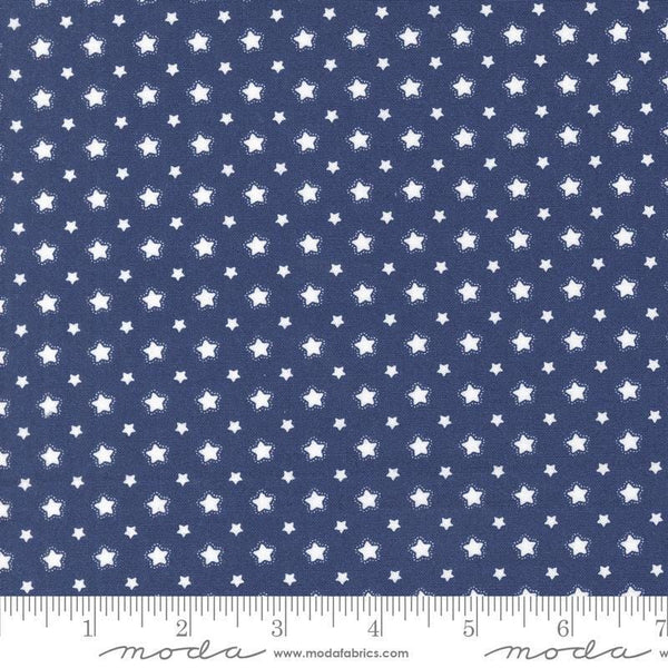 Image of the Star Spangled Folk Twilight quilting cotton fabric by Moda Fabrics. Features flowers on a blue background. Cute Little Fabric Shop