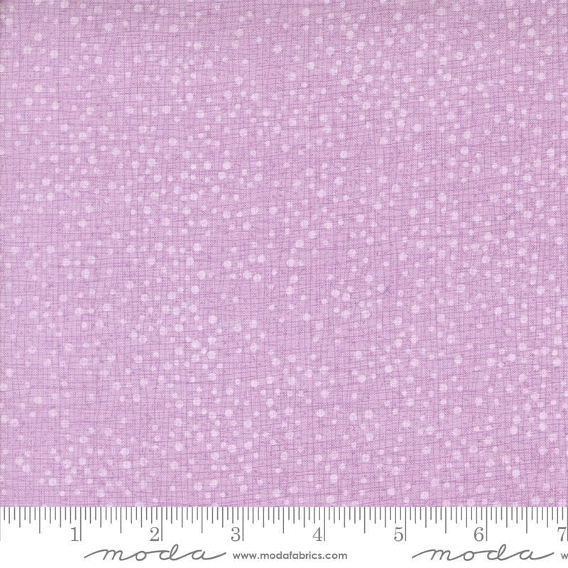 Dotty Thatched Dots Freesia quilting cotton fabrics by Robin Pickens for Moda Fabrics. Features lines and dots on a purple background. Cute Little Fabric Shop
