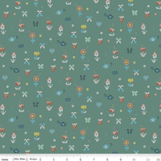 Image of the Sunsetridge Mosaic Lodge Pole quilting cotton fabric by Minki Kim for Riley Blake Designs. Features pixels on a green background. Cute Little Fabric Shop