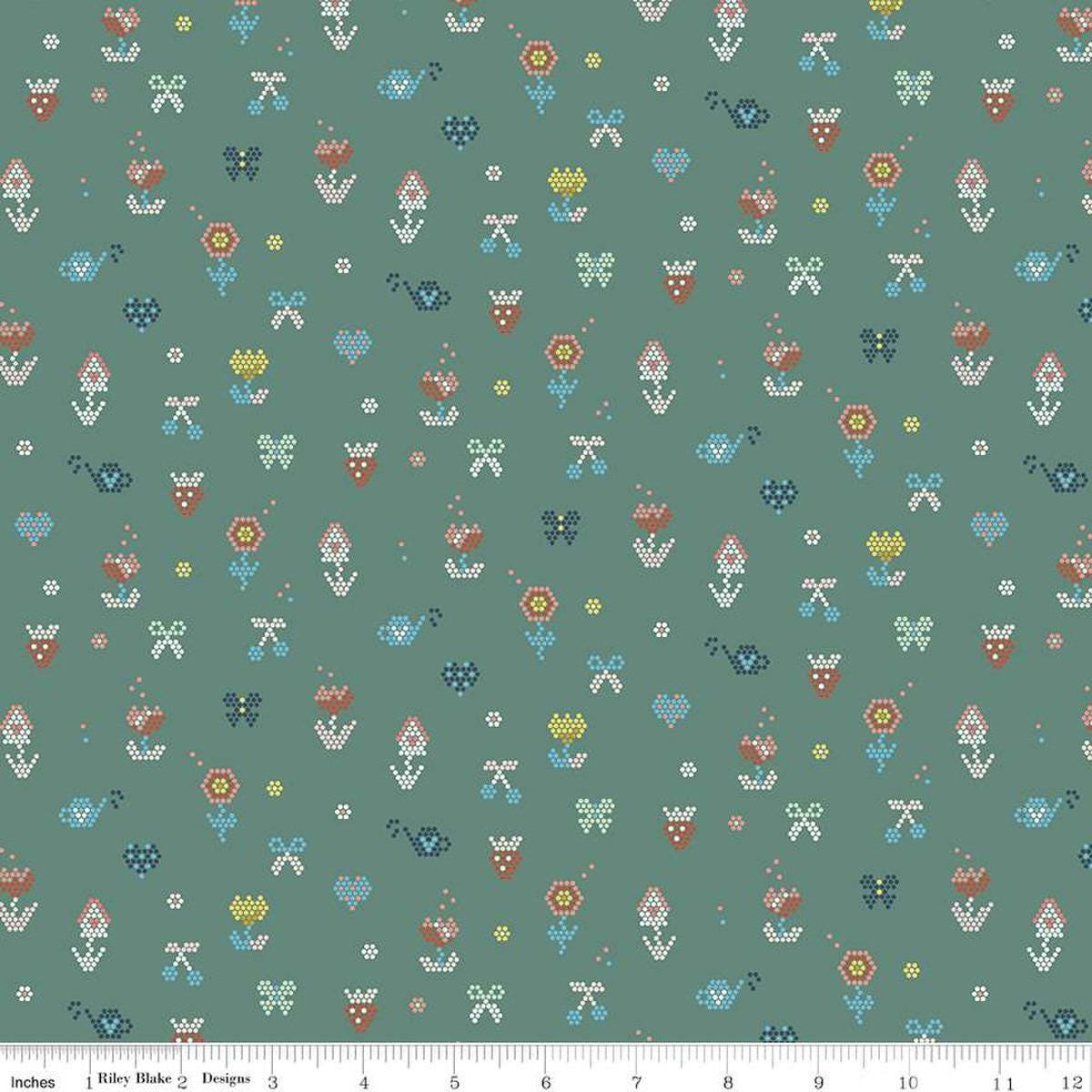 Image of the Sunsetridge Mosaic Lodge Pole quilting cotton fabric by Minki Kim for Riley Blake Designs. Features pixels on a green background. Cute Little Fabric Shop